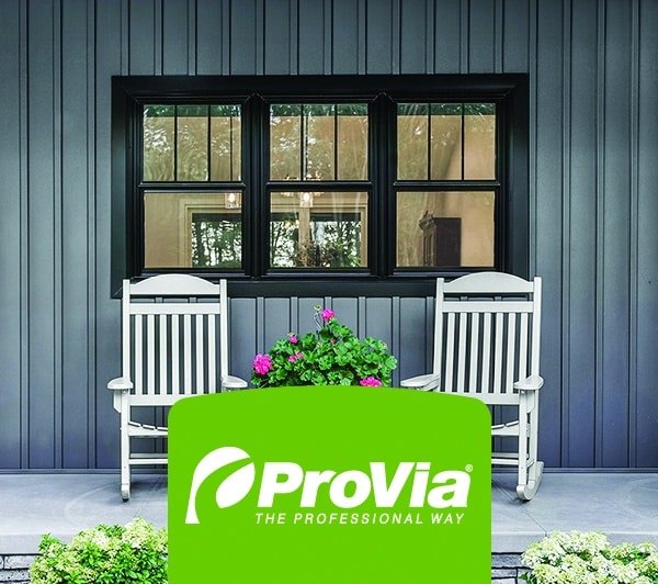Front porch photo of newly installed windows with logo overlaid reading “ProVia The Professional Way”